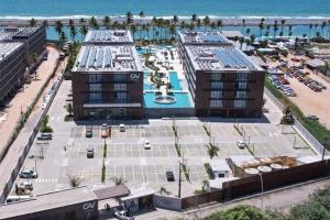 an aerial view of a large parking lot near the beach at PORTO ALTO RESORT - GAV - Praia do Muro Alto in Ipojuca