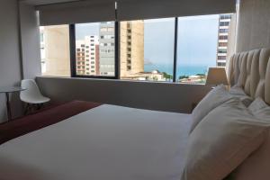 Ένα ή περισσότερα κρεβάτια σε δωμάτιο στο Hotel Ferré Miraflores