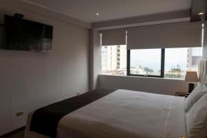Katil atau katil-katil dalam bilik di Hotel Ferré Miraflores