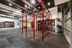 a gym with red poles in the middle of a room at Wellness Spa Suite by the Opera in Budapest