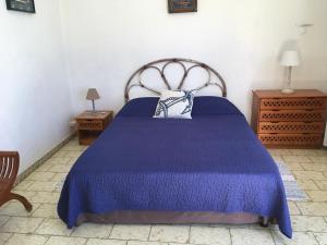A bed or beds in a room at Hotel Cap Sud Caraibes