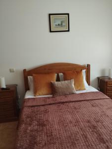 Giường trong phòng chung tại Apartamentos retiro novo baixo