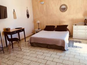 A bed or beds in a room at Hotel Cap Sud Caraibes