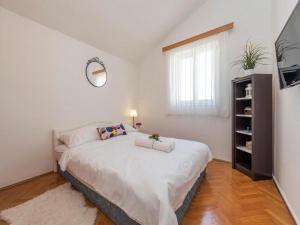 Postel nebo postele na pokoji v ubytování Villa Antonella