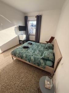Postel nebo postele na pokoji v ubytování Chambre centre gasperich