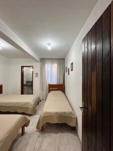 Thiferer Hostel客房内的一张或多张床位