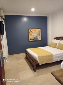 Postel nebo postele na pokoji v ubytování Hotel Ofis Versalles