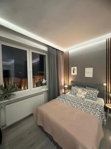 Posteľ alebo postele v izbe v ubytovaní Exclusive Apartments Smolna