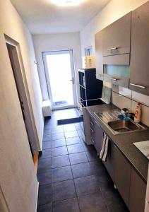 Kuchyň nebo kuchyňský kout v ubytování Apartmán KK