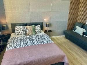 Posteľ alebo postele v izbe v ubytovaní Exclusive Apartments Smolna