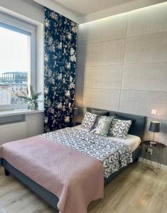 Posteľ alebo postele v izbe v ubytovaní Exclusive Apartments Smolna