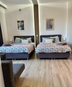 Posteľ alebo postele v izbe v ubytovaní Exclusive Apartments Smolna