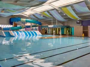 a large swimming pool with a water slide at Marsden Escape in Cayton