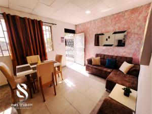 a living room with a couch and a table at Casa Scarlett in Cartagena de Indias +5 photos