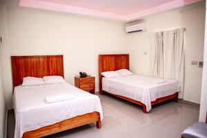 Postel nebo postele na pokoji v ubytování Hotel J&M