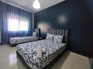 Postel nebo postele na pokoji v ubytování rabatcitycenterresidence