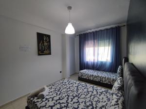 rabatcitycenterresidence客房内的一张或多张床位