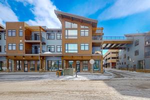 an apartment building under construction on a snowy street at Skywalk Flats Escape in Silverthorne