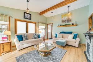 a living room with two couches and a fireplace at Boyne City Retreat Near Beaches and Mtn Resort! in Boyne City