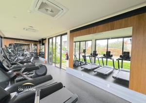 a gym with rows of treadmills and elliptical machines at Residence by Mio Nuevo Vallarta 103-C in Nuevo Vallarta
