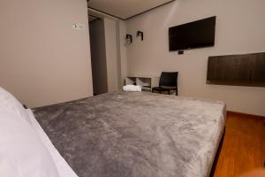 Voodi või voodid majutusasutuse HOTEL HTL toas