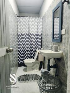 a bathroom with a sink and a toilet at Casa Scarlett in Cartagena de Indias