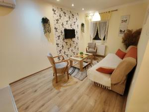 TV a/nebo společenská místnost v ubytování Ravana Sky Apartments