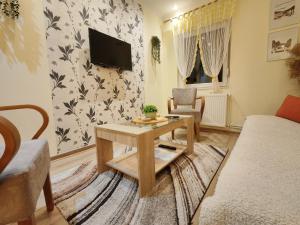 TV a/nebo společenská místnost v ubytování Ravana Sky Apartments