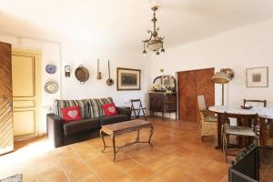 a living room with a couch and a table at S&C Apartments in Ilha da Madeira