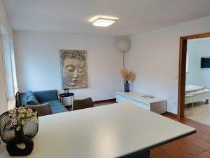 a living room with a couch and a table at Gemütliche Wohnung in Oberteuringen in Oberteuringen