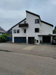 a large white building with a lot of windows at Gemütliche Wohnung in Oberteuringen in Oberteuringen