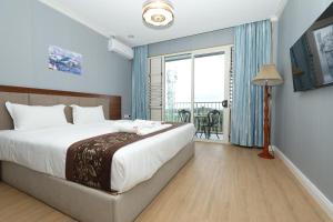 Postel nebo postele na pokoji v ubytování Yue Lai Hotel + 37 fotografií
