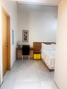 Ένα ή περισσότερα κρεβάτια σε δωμάτιο στο Flat Paiva Bugam - Paiva Home Stay