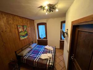 Postel nebo postele na pokoji v ubytování Casa Experience - Venas Di Cadore + 2 fotografie
