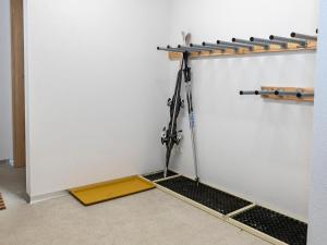 a room with a white wall with a plant at Tirolee Marchegg 2 OG Top 4 in Oberau