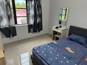 Postel nebo postele na pokoji v ubytování Chengai homestay