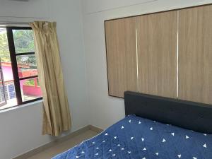 Postel nebo postele na pokoji v ubytování Chengai homestay