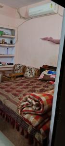 Ένα ή περισσότερα κρεβάτια σε δωμάτιο στο Home stay