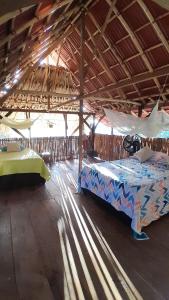 Postel nebo postele na pokoji v ubytování Casa Surya Naturaleza y Bienestar + 9 fotografií