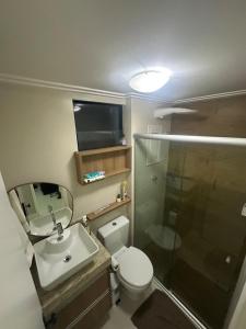 a bathroom with a toilet and a shower and a sink at Apt-igorss-aju in Aracaju