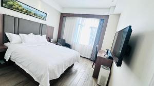 Televiisor ja/või meelelahutuskeskus majutusasutuses Bestway Hotel Xi'an