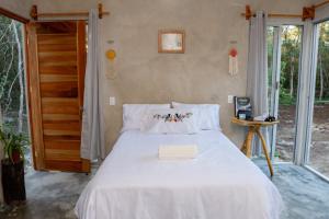 Postel nebo postele na pokoji v ubytování Xocen Birding Ecolodge
