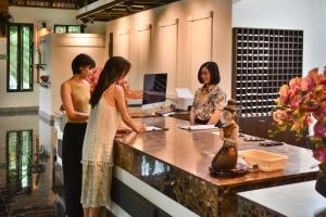 a group of women standing at a counter at Scenic Pool Villa and Resort in Ban Huai Yai +64 photos