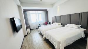 Voodi või voodid majutusasutuse Bestway Hotel Xi'an toas