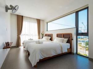 Ένα ή περισσότερα κρεβάτια σε δωμάτιο στο Basil Villa An Bàng Beach +32 φωτογραφίες