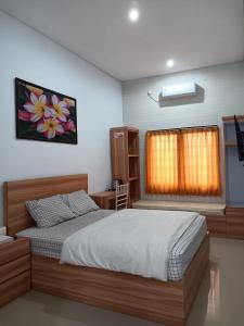 Ένα ή περισσότερα κρεβάτια σε δωμάτιο στο Namastay Bali