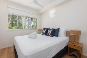 Postel nebo postele na pokoji v ubytování Coral Apartments Port Douglas