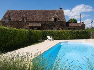 a house and a swimming pool in front of a house at Charmante maison en pierre avec piscine privée, 8 personnes, proche des Bastides - FR-1-824-19 in Le Buisson de Cadouin