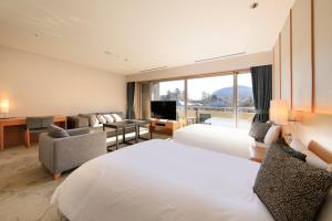 Postel nebo postele na pokoji v ubytování Hakone Hisui + 37 fotografií
