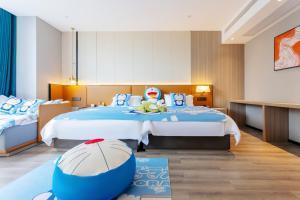 Voodi või voodid majutusasutuse Dujiangyan Yuandong Yaju Hotel toas